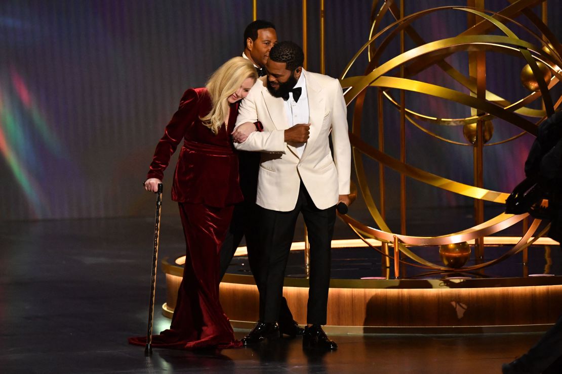 Actor Anthony Anderson and US actress Christina Applegate arrive onstage during the 75th Emmy Awards at the Peacock Theatre at L.A. Live in Los Angeles on January 15, 2024. (Photo by Valerie Macon / AFP) (Photo by VALERIE MACON/AFP via Getty Images)