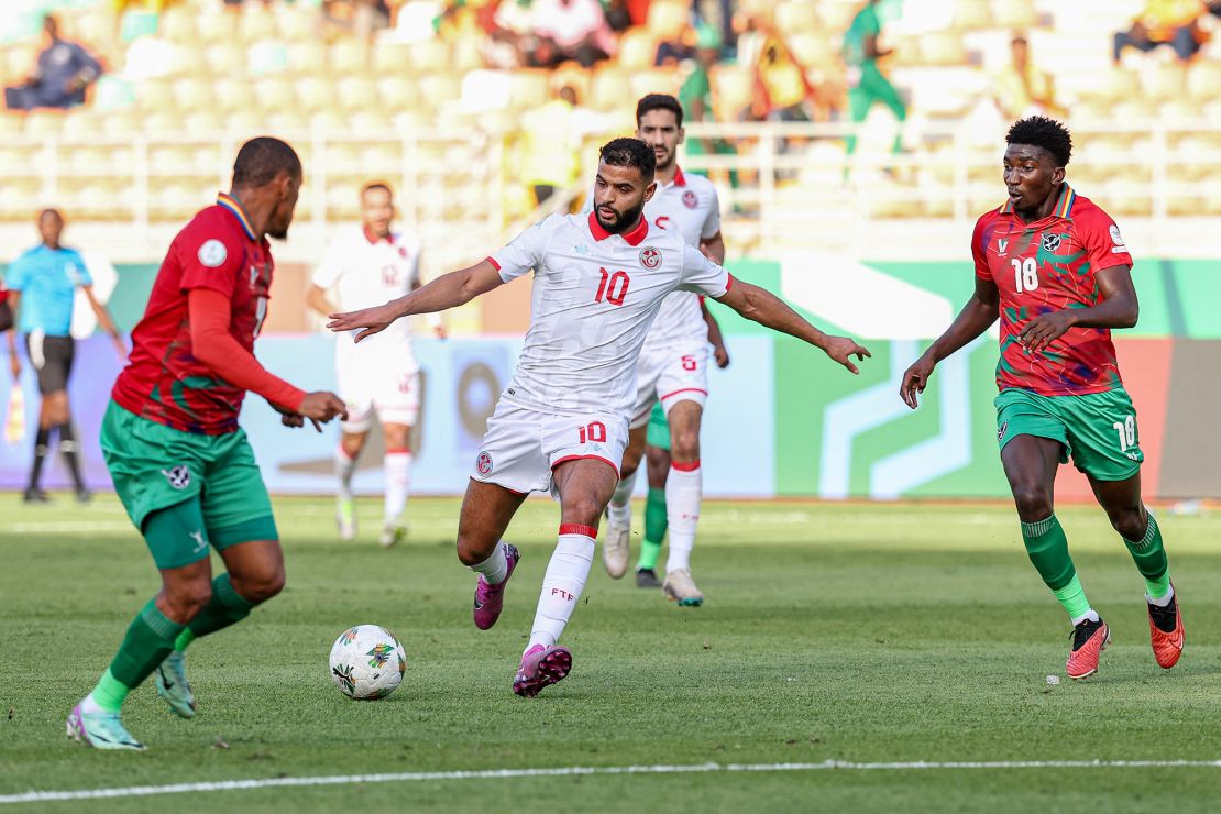 TOPSHOT - Tunisia's midfielder #10 Anis Ben Slimane (C) fights for the ball with Namibia's defender #18 Aprocius Petrus (R) during the Africa Cup of Nations (CAN) 2024 group E football match between Tunisia and Namibia at Amadou Gon Coulibaly Stadium in Korhogo on January 16, 2024. (Photo by Fadel SENNA / AFP) (Photo by FADEL SENNA/AFP via Getty Images)