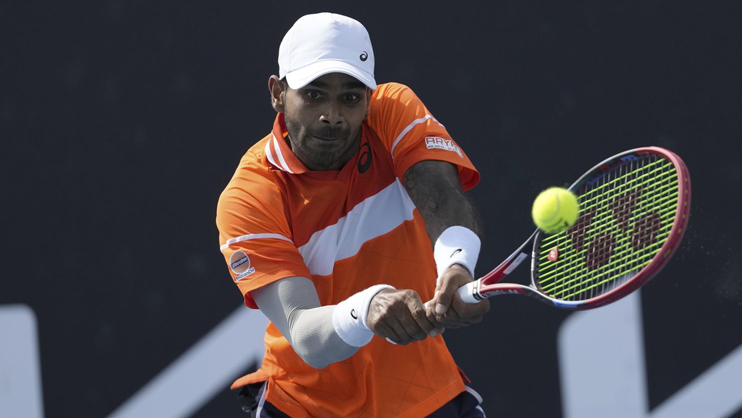 Sumit Nagal of India plays a backhand return to Alexander Bublik of Kazakhstan during their first round match at the Australian Open tennis championships at Melbourne Park, Melbourne, Australia, Tuesday, Jan. 16, 2024. (AP Photo/Alessandra Tarantino)