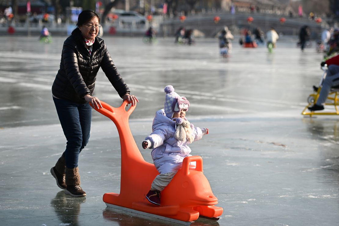 A toddler enjoying ice-skating in Beijing on December 28, 2023