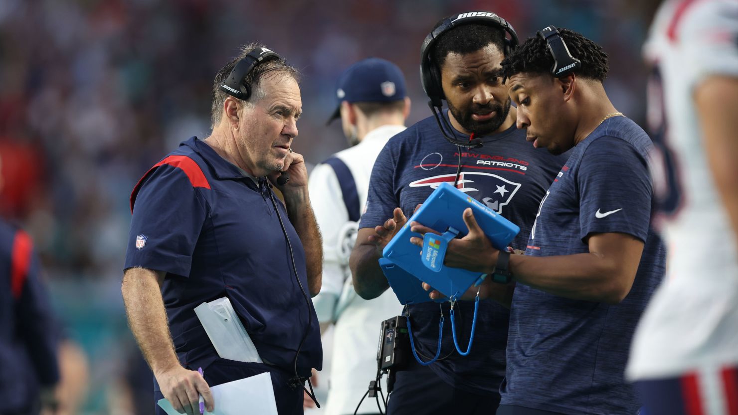 MIAMI GARDENS, FL - JANUARY 9: New England Patriots head coach Bill Belichick, inside linebackers coach Jerod Mayo, and defensive line coach DeMarcus Covington on the sideline  against the Miami Dolphins  at Hard Rock Stadium on January 9, 2022 in Miami Gardens, Florida. (Photo by Perry Knotts/Getty Images)
