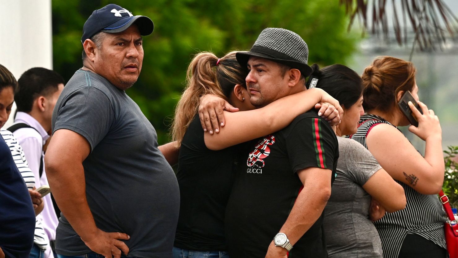 Relatives of slain Prosecutor Cesar Suarez remain outisde the morgue in Guayaquil, Ecuador on January 17, 2024. A prosecutor charged with investigating the dramatic live-broadcast armed assault last week on an Ecuadoran television station was shot dead Wednesday, the country's attorney general said. "In the face of the murder of our colleague Cesar Suarez ... I am going to be emphatic: organized crime groups, criminals, terrorists will not stop our commitment to Ecuadoran society," said Attorney General Diana Salazar in a statement on X. (Photo by Marcos PIN / AFP) (Photo by MARCOS PIN/AFP via Getty Images)