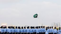 Members of the Pakistan Air Force (PAF) stand in formation during the national anthem, as a part of the Defence Day ceremonies, or Pakistan's Memorial Day, in Karachi, Pakistan September 6, 2021. REUTERS/Akhtar Soomro
