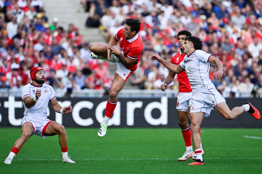 Wales' wing Louis Rees-Zammit (C) leaps to catch a high ball during the France 2023 Rugby World Cup Pool C match between Wales and Georgia at the Stade de la Beaujoire in Nantes, western France on October 7, 2023.
