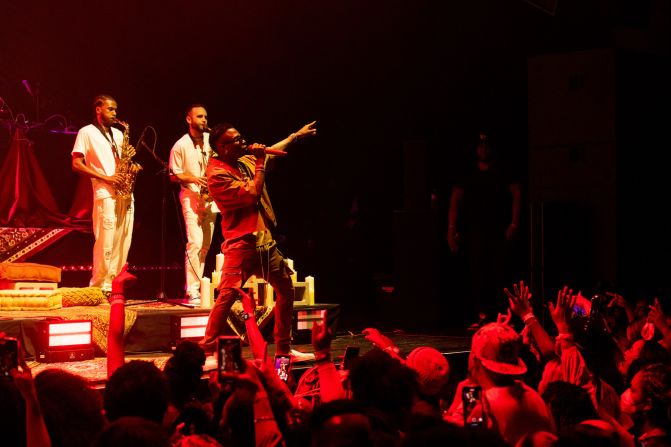 Fellow Nigerian Afrobeats star WizKid has a Grammy win in the Best Music Video category, for his collaboration on the track "Brown Skin Girl" with Beyoncé and Blue Ivy at the 63rd Grammys in 2021. Pictured: WizKid performs during a show at The Wiltern in LA, September 2021.