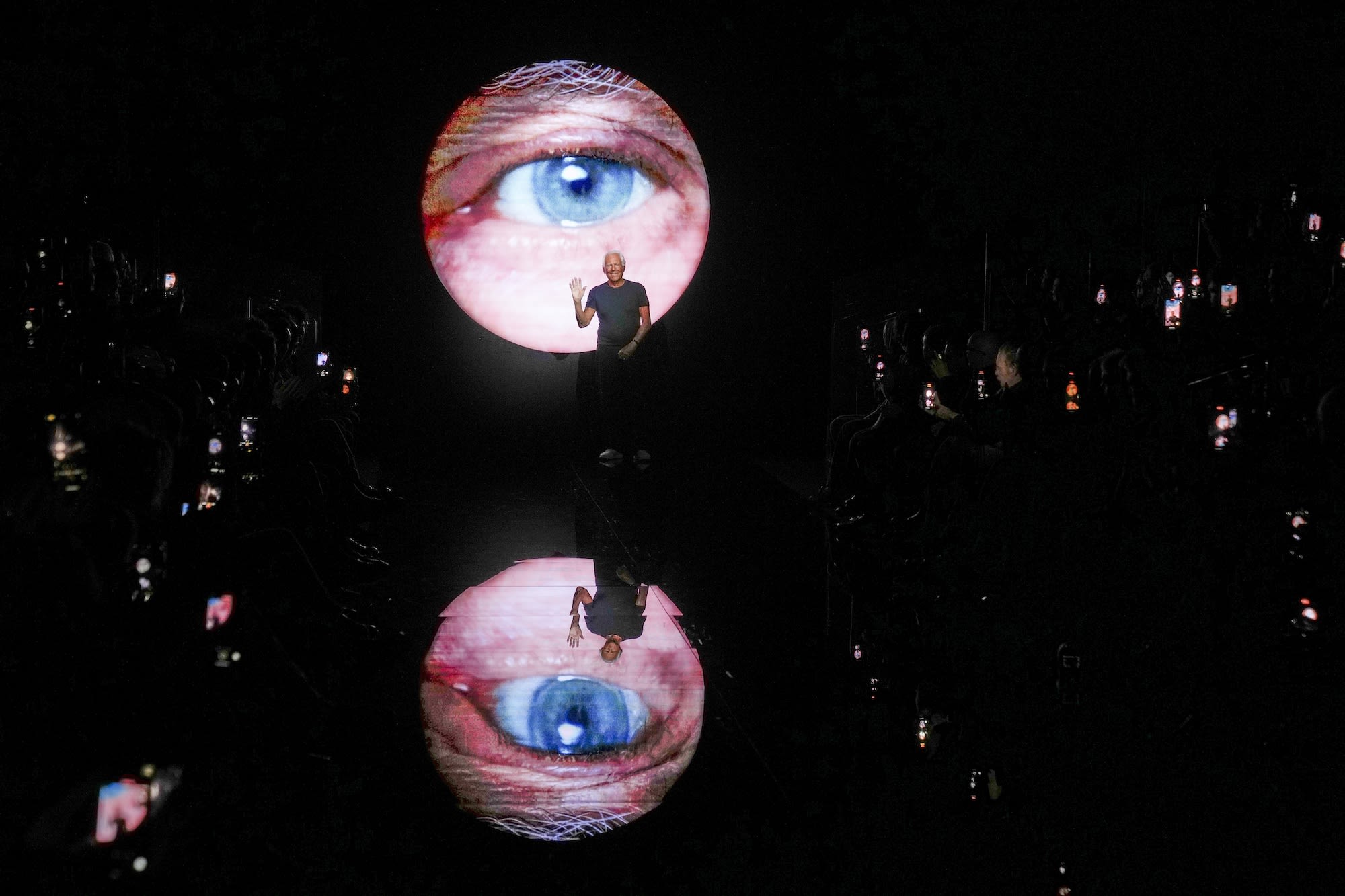 Giorgio Armani accepts applause after the conclusion of his Men's Fall-Winter 2024-25 collection presentation in Milan.