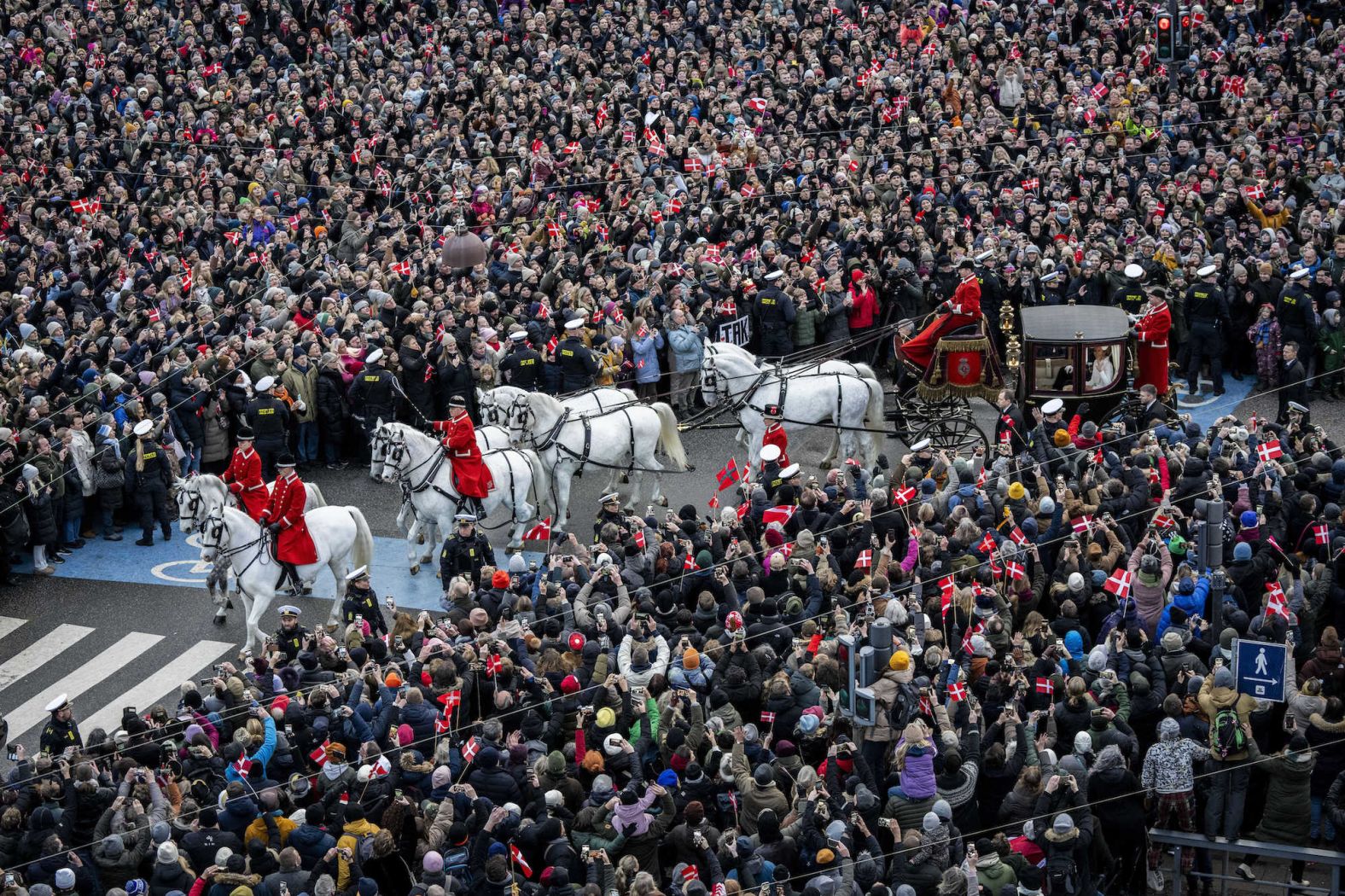 <a href="index.php?page=&url=https%3A%2F%2Fwww.cnn.com%2F2024%2F01%2F14%2Feurope%2Fdenmark-royals-frederik-mary-proclamation-king-queen-intl%2Findex.html" target="_blank">Denmark's King Frederik X</a> and his wife, Queen Mary, ride in a carriage back to Amalienborg Palace in Copenhagen, Denmark, on Sunday, January 14. King Frederik X took the throne Sunday after the abdication of his mother <a href="index.php?page=&url=https%3A%2F%2Fwww.cnn.com%2F2023%2F12%2F31%2Feurope%2Fqueen-margrethe-denmark-abdication-intl%2Findex.html" target="_blank">Queen Margrethe II</a>.