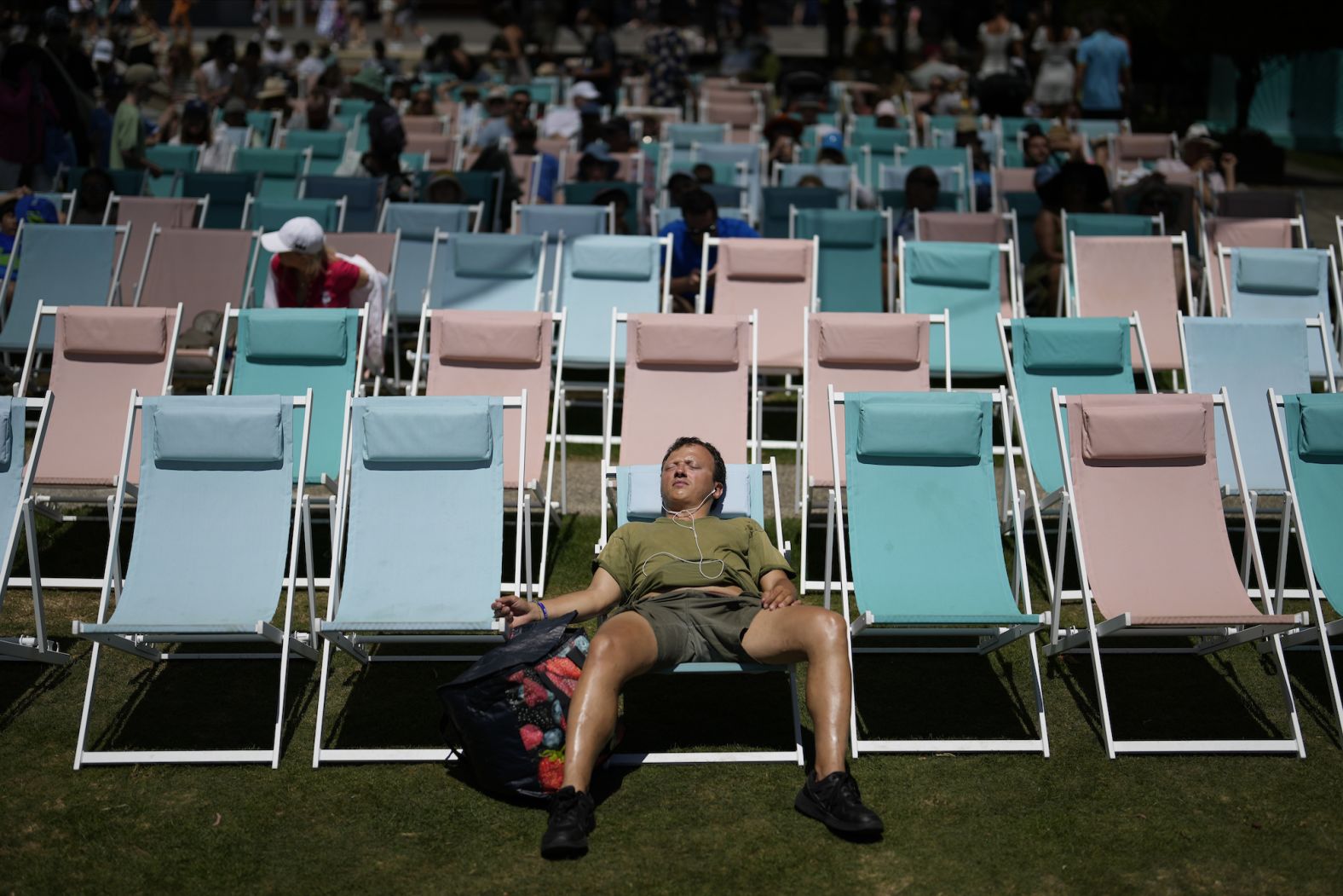 A spectator relaxes in a deck chair at the Australian Open tennis championships in Melbourne, Australia, on Tuesday, January 16. 