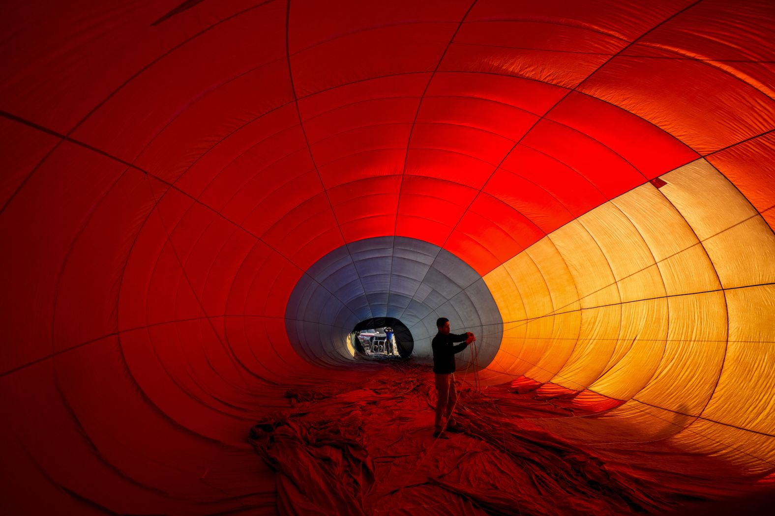 A crew member adjusts a hot air balloon at a festival in Santiago, Chile, on Saturday, January 13.