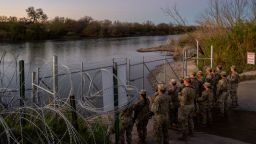 EAGLE PASS, TEXAS - JANUARY 12: National Guard soldiers stand guard on the banks of the Rio Grande river at Shelby Park on January 12, 2024 in Eagle Pass, Texas. The Texas National Guard continues its blockade and surveillance of Shelby Park in an effort to deter illegal immigration. The Department of Justice has accused the Texas National Guard of blocking Border Patrol agents from carrying out their duties along the river. (Photo by Brandon Bell/Getty Images)