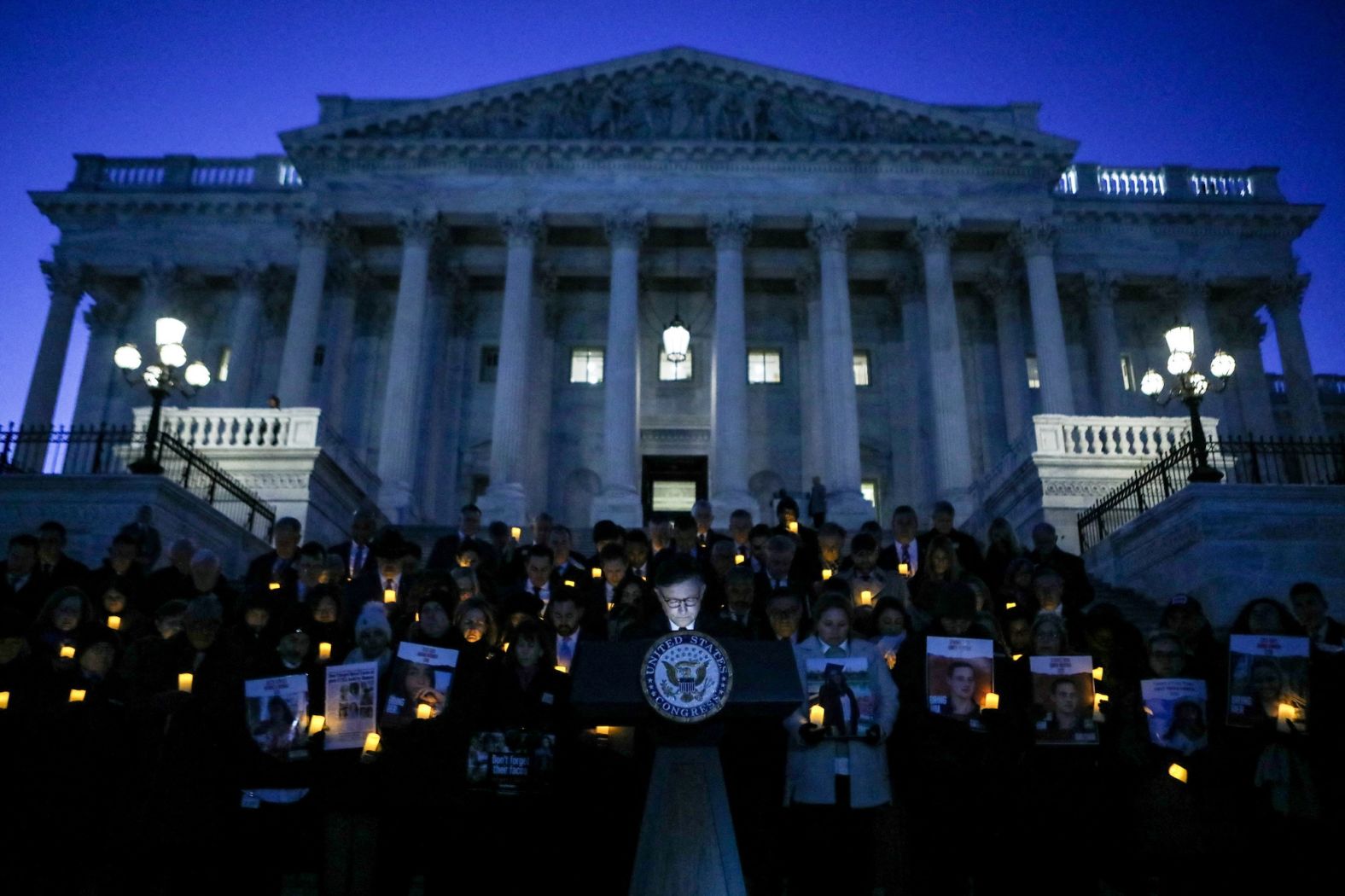 US House Speaker Mike Johnson speaks during a vigil with family members of hostages and victims of Hamas on the steps of the US House of Representatives in Washington, DC, on Wednesday, January 17.