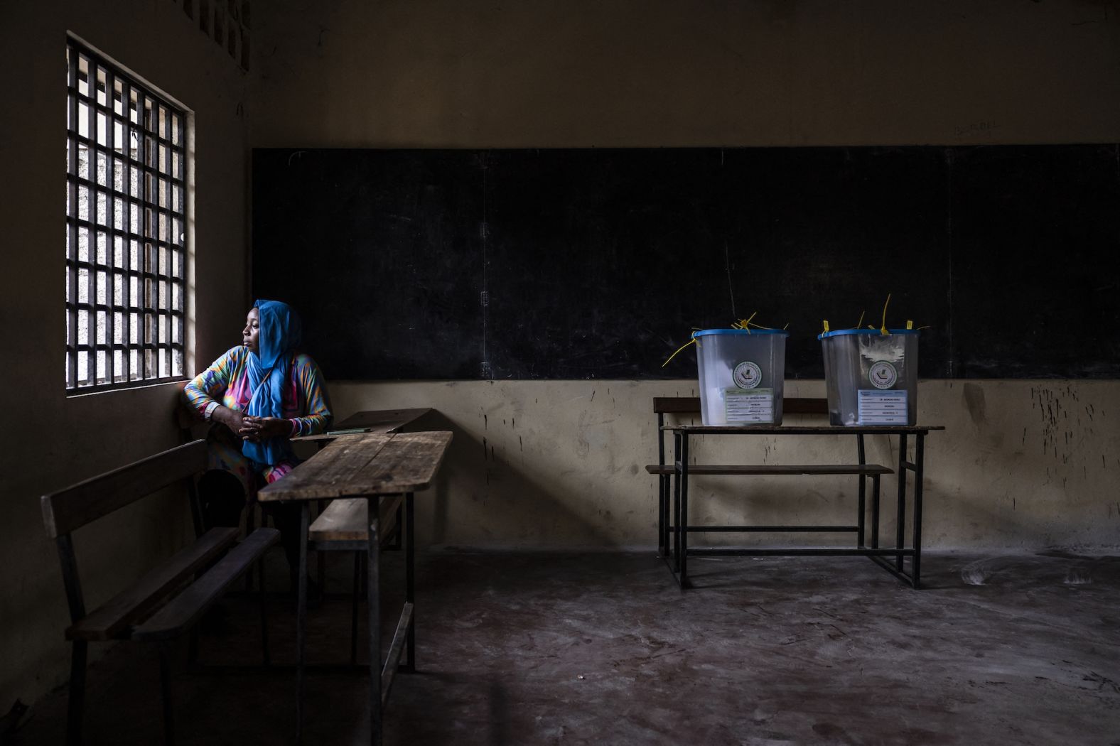 A polling station official waits for voters to arrive in Moroni, Comoros, on Sunday, January 14. Comoran voters went to polling stations to decide whether to hand a third-straight term to President Azali Assoumani.