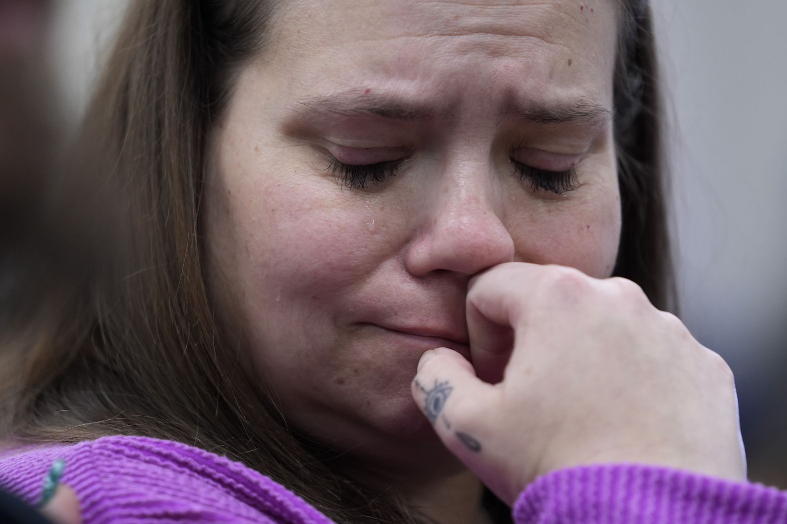 Nikki Cross tries to hold back tears as she and other family members of shooting victims listen to a US Justice Department press conference in Uvalde, Texas, on Thursday, January 18. Justice Department officials presented a <a href="index.php?page=&url=https%3A%2F%2Fwww.cnn.com%2F2024%2F01%2F18%2Fus%2Fattorney-general-garland-uvalde-victims-thursday%2Findex.html" target="_blank">new report</a> that concluded officers had many opportunities as the 2022 school massacre at Robb Elementary in Uvalde was still unfolding to reassess <a href="index.php?page=&url=https%3A%2F%2Fwww.cnn.com%2Finteractive%2F2023%2F05%2Fus%2Ftimeline-uvalde-school-shooting%2F" target="_blank">their flawed response</a> to the shooting that left <a href="index.php?page=&url=https%3A%2F%2Fwww.cnn.com%2Finteractive%2F2023%2F05%2Fus%2Fvictims-uvalde-school-shooting%2F" target="_blank">19 children and two teachers</a> dead.