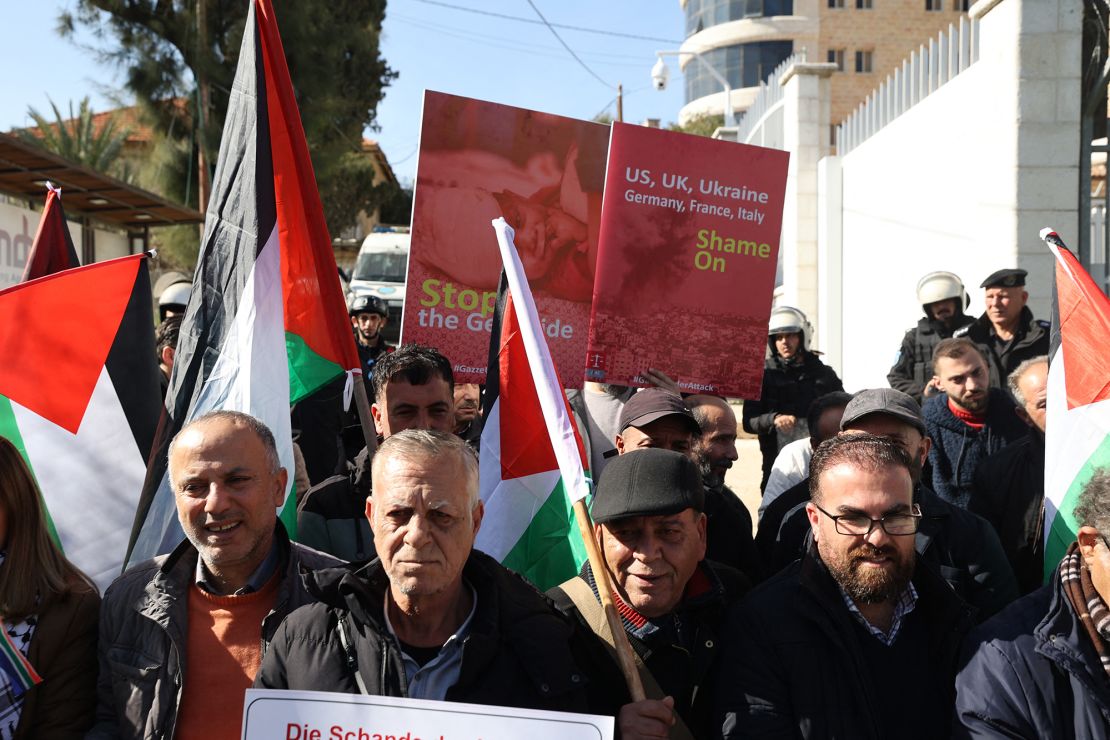 EDITORS NOTE: Graphic content / Palestinians protest in front of the German representation in the city of Ramallah, against what they call "Germany's policy of supporting Israel in the war on Gaza", on January 18, 2024, amid ongoing battles between Israel and the Palestinian militant group Hamas. (Photo by Jaafar ASHTIYEH / AFP) (Photo by JAAFAR ASHTIYEH/AFP via Getty Images)