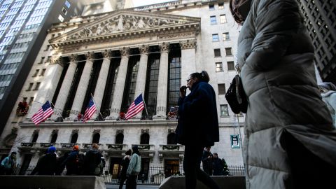 Pedestrians in front of the New York Stock Exchange (NYSE) in New York, US, on Tuesday, Jan. 2, 2024.