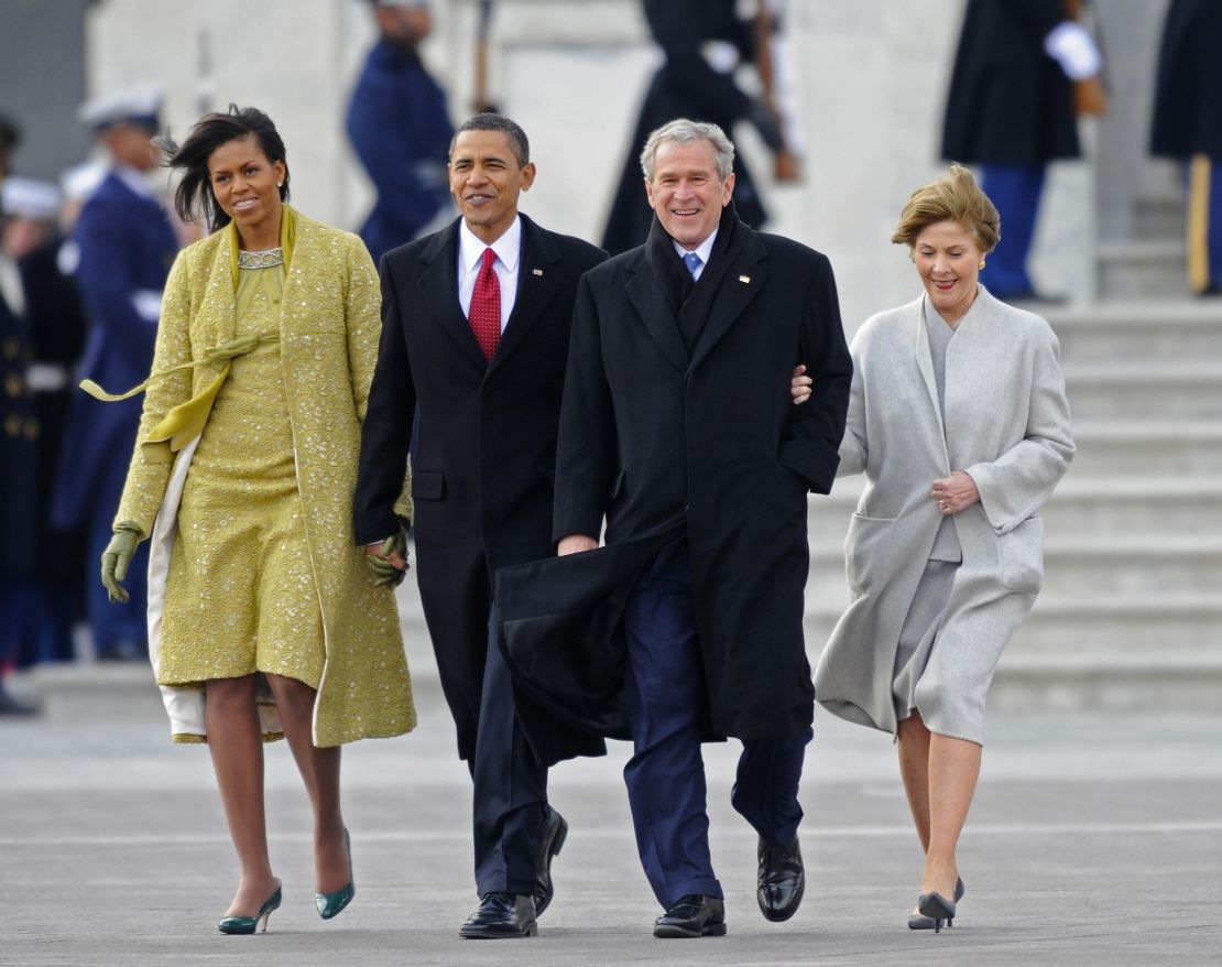 Former US President George W. Bush (2nd-R) and his wife Laura (R) are escorted to a waiting helicopter by President Barack Obama (2nd-L) and his wife Michelle as Bush departs from the US Capitol after the swearing in of Obama as the 44th President of the United States during the 56th Presidential Inauguration ceremony in Washington, DC, January 20, 2009. AFP PHOTO/POOL/TANNEN MAUREY (Photo credit should read TANNEN MAURY/AFP via Getty Images)