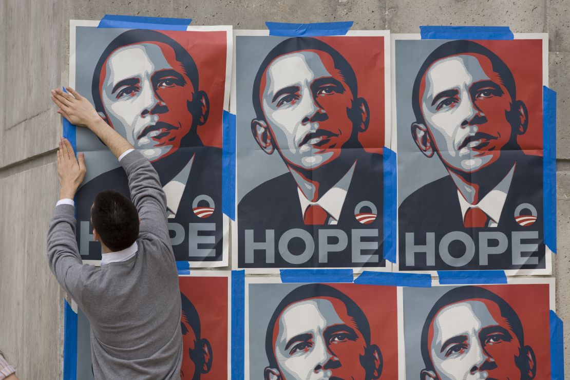 A supporter of Democratic presidential hopeful Barack Obama pastes up posters outside the Rec Sports Center at the Univeristy of Texas at Austin hours prior to the debate. (Photo by Robert Daemmrich Photography Inc/Corbis via Getty Images)