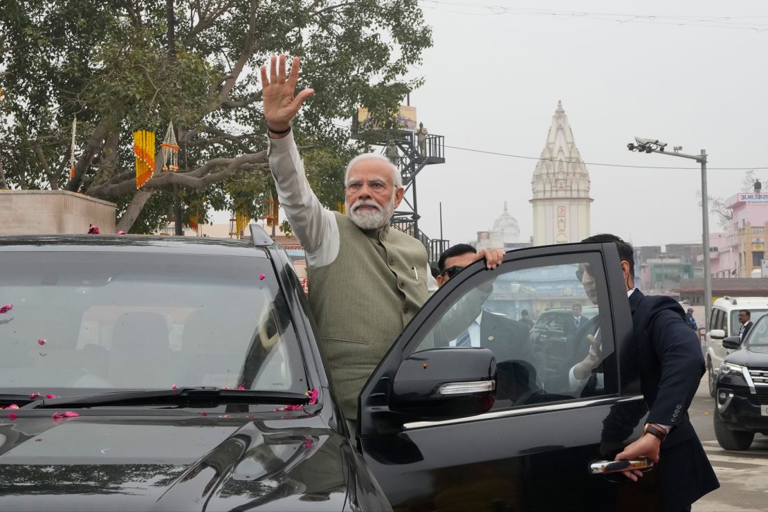 Indian Prime Minister Narendra Modi waves to the crowd during a road show before inaugurating a new airport and a railway station in Ayodhya, India, Saturday, Dec. 30, 2023. (AP Photo/Rajesh Kumar Singh)