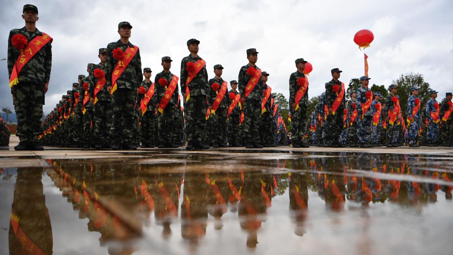 KUNMING, CHINA - SEPTEMBER 15: More than 500 new recruits of the People's Liberation Army (PLA) take part in a farewell ceremony at a militia training base on September 15, 2020 in Kunming, Yunnan Province of China. (Photo by Liu Ranyang/China News Service via Getty Images)