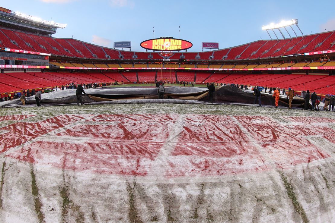 KANSAS CITY, MO - JANUARY 13: A view of the frozen field as the grounds crew removes the tarp in the brutal cold before an AFC Wild Card playoff game between the Miami Dolphins and Kansas City Chiefs on Jan 13, 2024 at GEHA Field at Arrowhead Stadium in Kansas City, MO. (Photo by Scott Winters/Icon Sportswire via Getty Images)