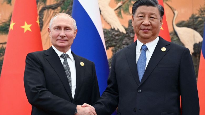 This pool photograph distributed by Russian state owned agency Sputnik shows Russia's President Vladimir Putin and Chinese President Xi Jinping shaking hands during a meeting in Beijing on October 18, 2023.