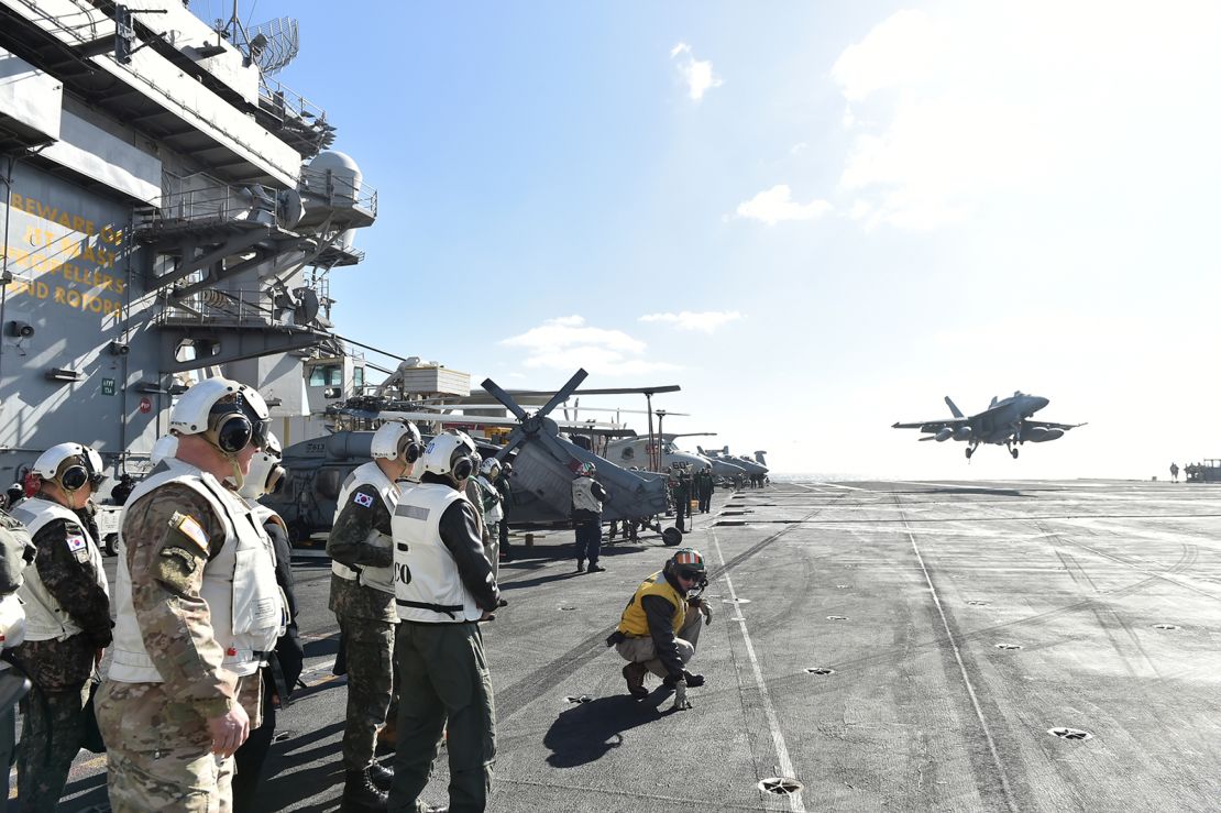 Chief of JCS Kim Myung-soo inspecting the landing and taking off situations of aircrafts on USS Carl Vincon during the trilateral exercise in the waters south of the Jeju Island on January 15, 2024.
