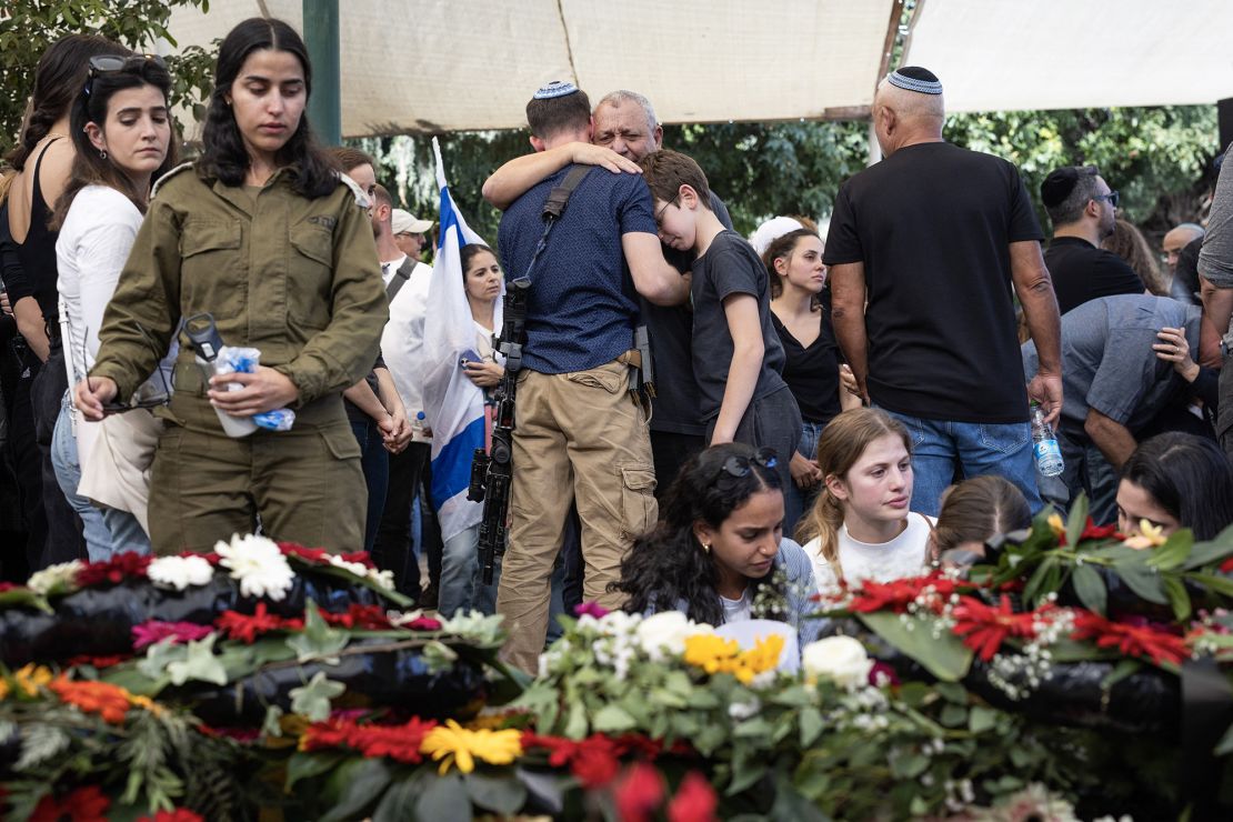 Israeli government's war cabinet member Gadi Eizenkot (C) reacts during the funeral of his son Gal Eizenkot in Herzliya, on December 8, 2023, a day after he was killed in combat with Hamas militants in the Gaza Strip. Israel on December 7, 2023 announced the deaths of two more soldiers in combat in Gaza, bringing the total to 89 since it began its offensive. (Photo by Oren ZIV / AFP) (Photo by OREN ZIV/AFP via Getty Images)