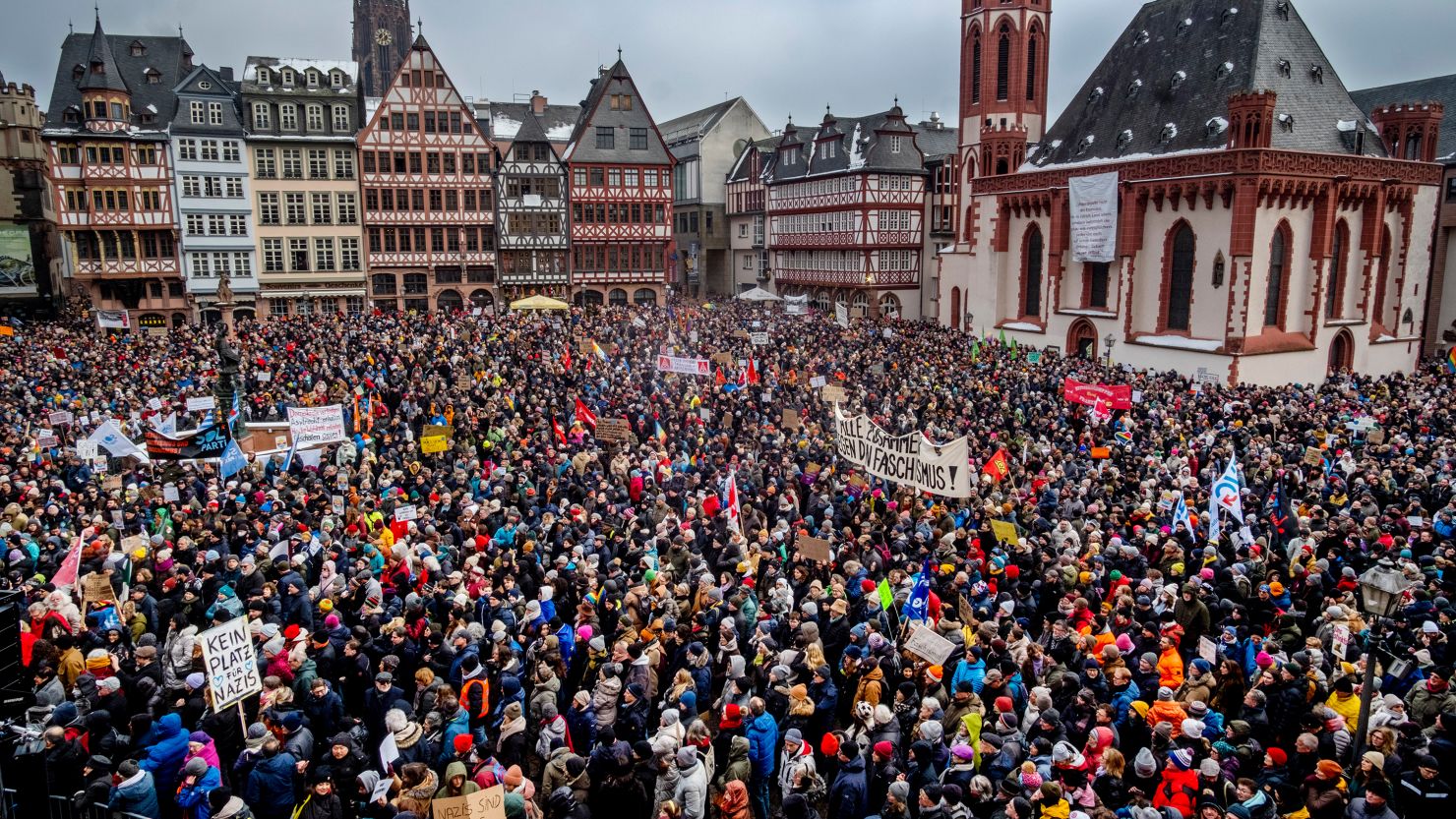 People gather as they protest against the AfD party and right-wing extremism in Frankfurt/Main, Germany, Saturday, Jan. 20, 2024.