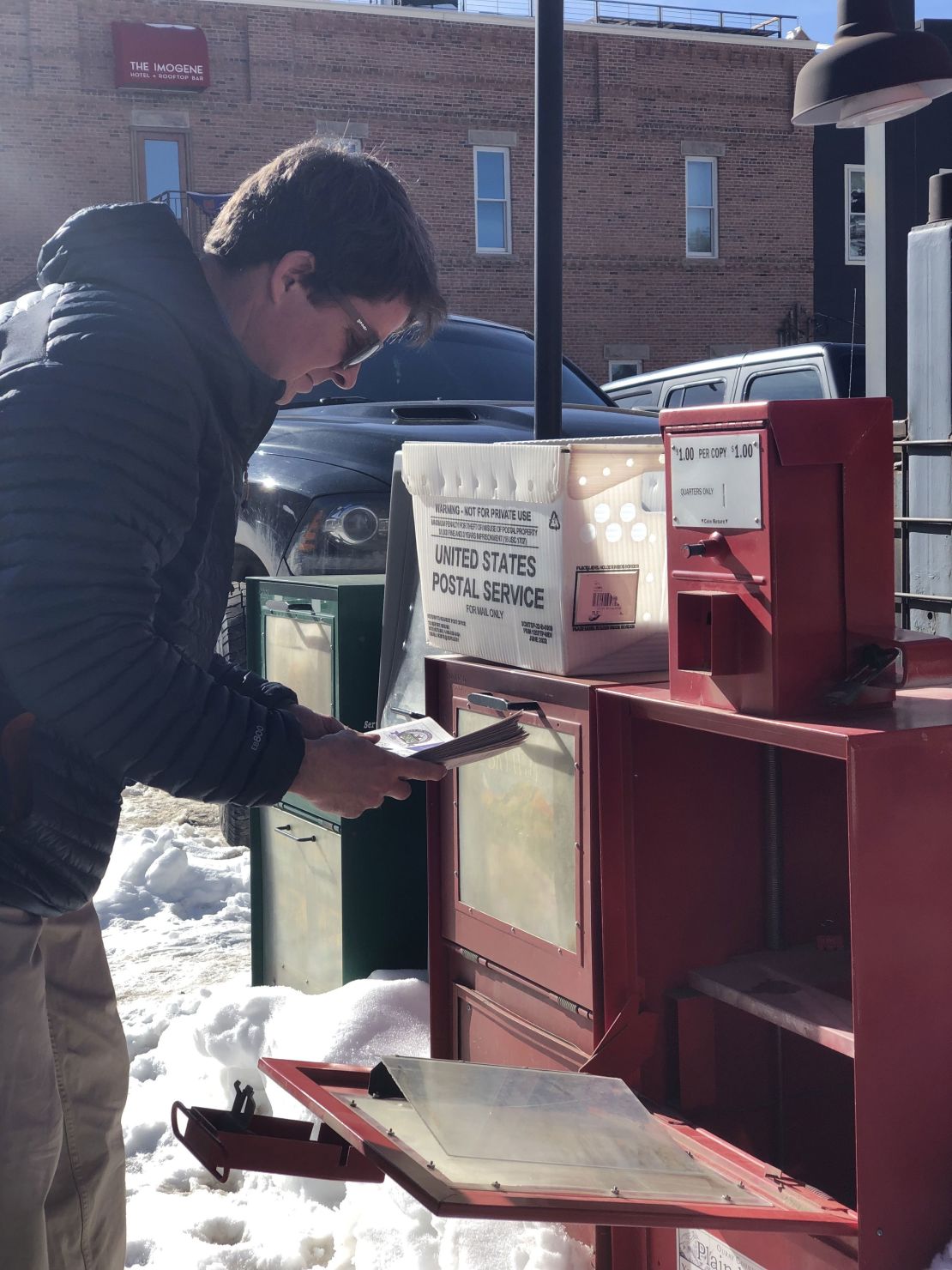 Co-publisher, Mike Wiggins, stocks newspaper racks with re-printed copies.