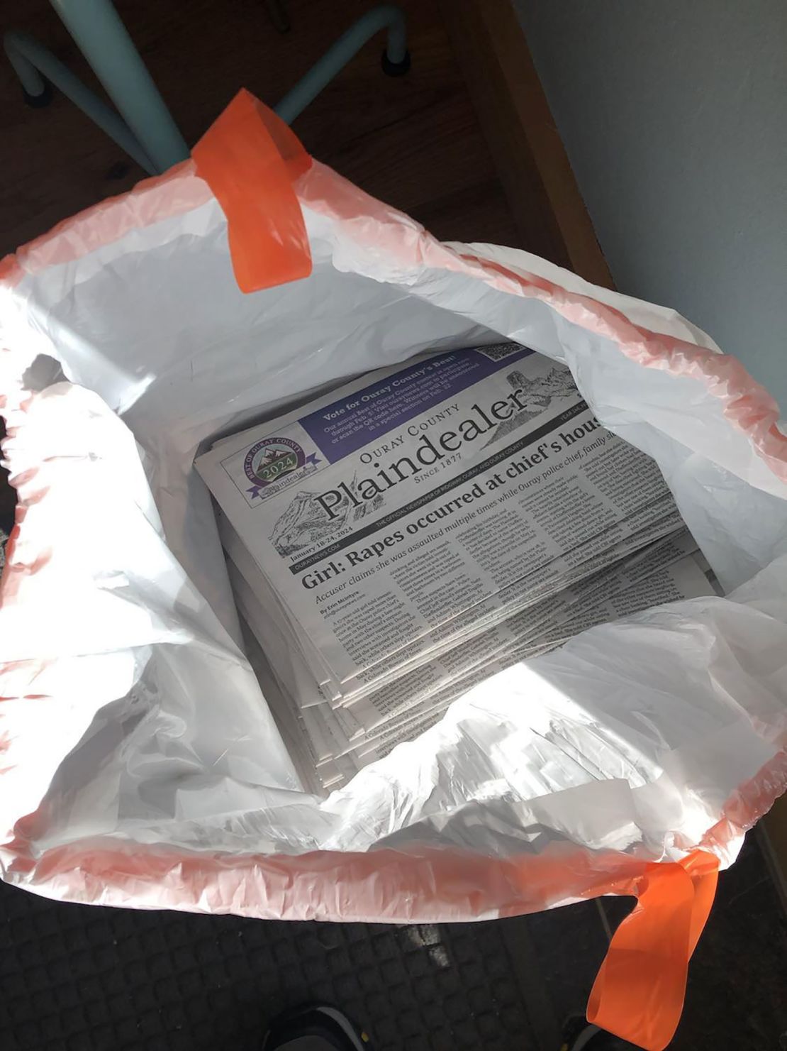 The newspapers were returned in a garbage bag on Thursday evening.