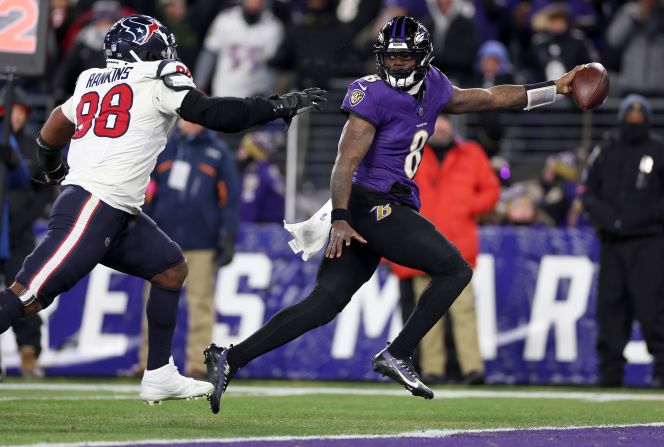 Baltimore Ravens quarterback Lamar Jackson evades Houston Texans defensive tackle Sheldon Rankins to score an 8 yard touchdown on January 20 in Baltimore. The Ravens won 34-10 and earned a spot in the AFC Championship game next weekend, their first since the 2012 season.