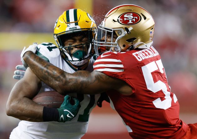 San Francisco 49ers linebacker Dre Greenlaw tackles Green Bay Packers running back Emanuel Wilson on Saturday, January 20, at Levi's Stadium in Santa Clara, California. The 49ers won 24-21 and will move on to the NFC Championship game.