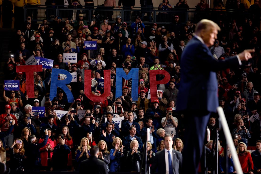 Republican presidential candidate and former President Donald Trump takes the stage during a campaign rally at the SNHU Arena on January 20, 2024 in Manchester, New Hampshire.