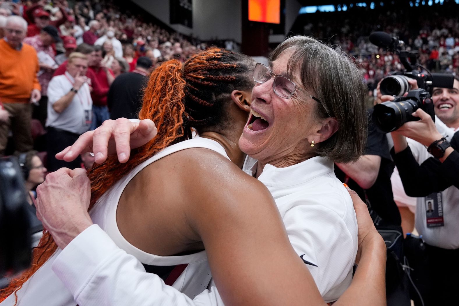 Stanford head coach Tara VanDerveer, right, is congratulated by forward Kiki Iriafen after the team's victory over Oregon State made her <a href="index.php?page=&url=https%3A%2F%2Fwww.cnn.com%2F2024%2F01%2F21%2Fsport%2Fstanford-tara-vanderveer-ncaa-coach-spt-intl%2Findex.html" target="_blank">the winningest head coach in college basketball history</a> on Sunday, January 21.