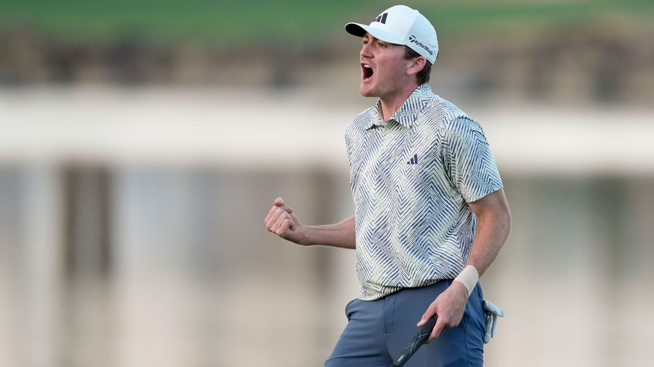 Nick Dunlap reacts after making his putt on the 18th hole of the Pete Dye Stadium Course during the final round to win the American Express golf tournament, Sunday, Jan. 21, 2024, in La Quinta, Calif. (AP Photo/Ryan Sun)