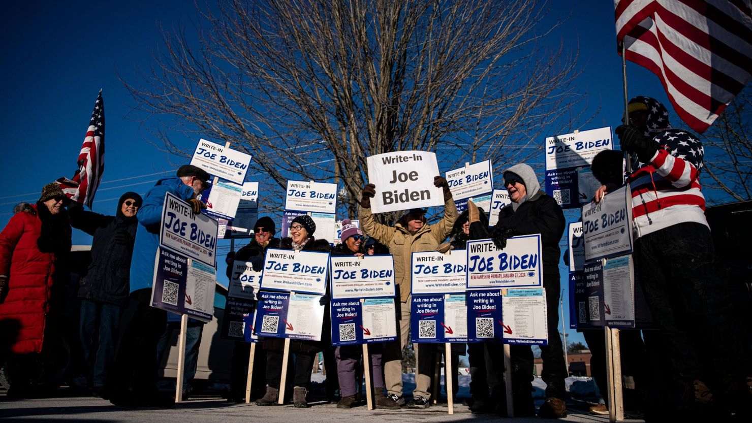 Attendees hold signs during a Write-In Joe Biden campaign "Get Out The Vote" event in Dover, New Hampshire, US, on Sunday, Jan. 21, 2024.