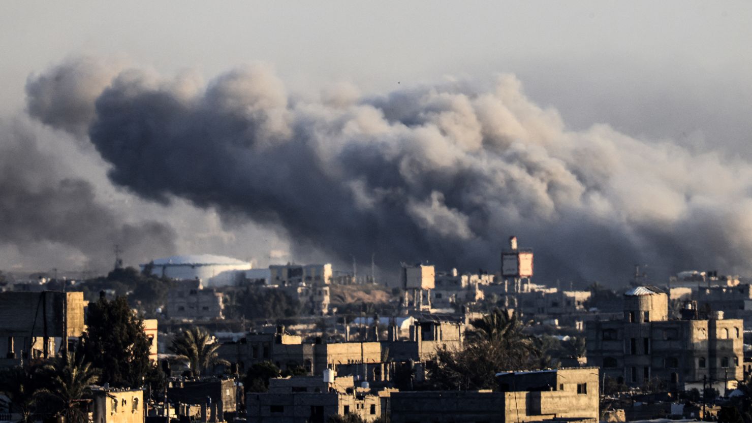 TOPSHOT - This photograph taken on January 22, 2024 from Rafah, shows smoke billowing during Israeli bombardment over Khan Younis in the southern Gaza Strip, amid ongoing battles between Israel and the Palestinian militant group Hamas. (Photo by AFP) (Photo by -/AFP via Getty Images)