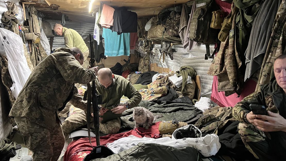 Crammed into their dugout, the crew of a US-supplied 155mm howitzer try to relax between fire missions. Limited ammunition mean firing far fewer shells than they would like.