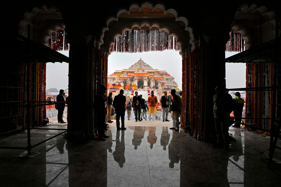 People arrive ahead of the inauguration of the temple of the Hindu god Ram in Ayodhya, northern Uttar Pradesh state, India, Monday, January 22, 2024.