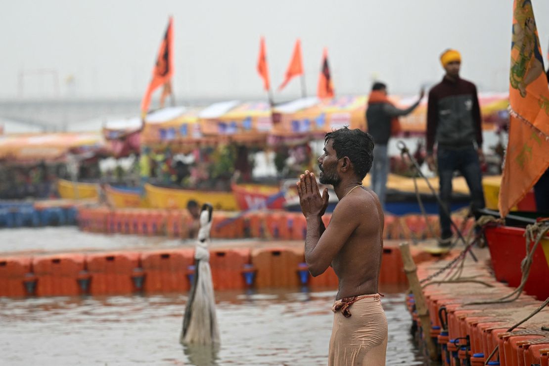 A man prays on the banks of Sarayu River on the occasion of Ram temple's consecration ceremony in Ayodhya on January 22, 2024.