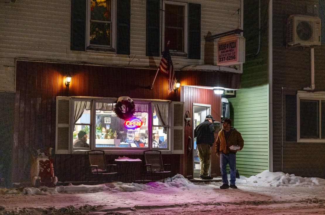 Patrons leave the House of Pizza on a frigid winter night in rural northern New Hampshire on January 20, 2024 in Colebrook, New Hampshire.