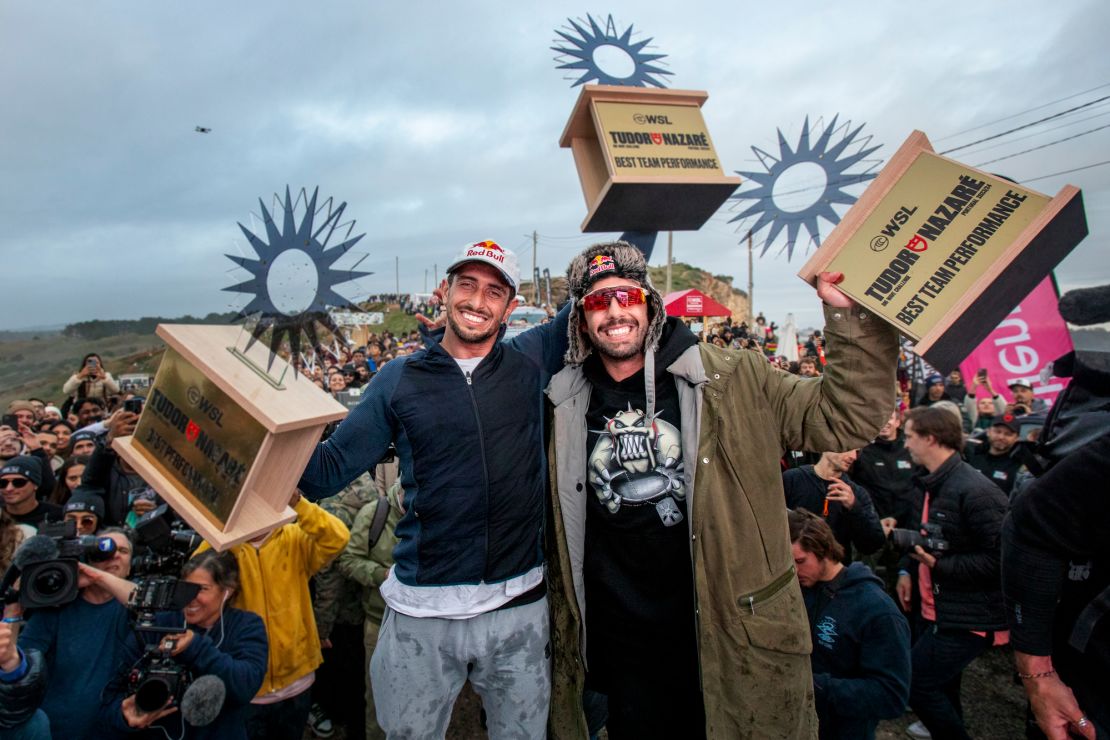 Lucas Chianca and Pedro Scooby celebrate on the podium during WSL Big Wave Tour in Nazare, Portugal on January 22, 2024 // Hugo Silva / Red Bull Content Pool via AP Images  // For more content, pictures and videos like this please go to http://www.redbullcontentpool.com