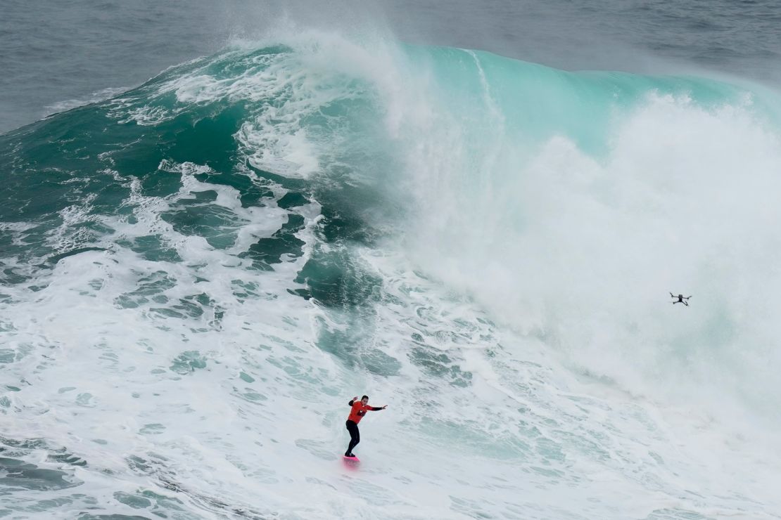 Maya Gabeira, from Brazil, rides a wave during the Nazare Big Wave Challenge surfing tournament at Praia do Norte, or North Beach, in Nazare, Portugal, Monday, Jan. 22, 2024. (AP Photo/Armando Franca)