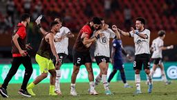 Egypt's forward #19 Mostafa Mohamed (2R) celebrates with teammates after scoring his team's second goal during the Africa Cup of Nations (CAN) 2024 group B football match between Cape Verde and Egypt at the Felix Houphouet-Boigny Stadium in Abidjan on January 22, 2024. (Photo by FRANCK FIFE / AFP) (Photo by FRANCK FIFE/AFP via Getty Images)