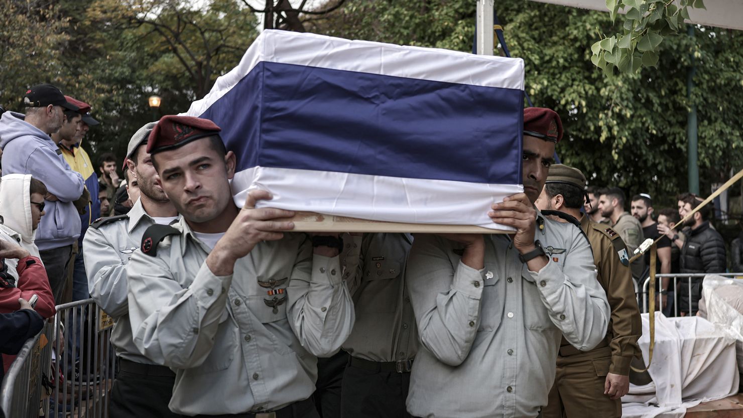 23 January 2024, Israel, Tel Aviv: Israeli soldiers hold soldier Major Ilay Levy's coffin during his funeral. Levy was killed when two buildings collapsed after Palestinians fired anti-tank missiles at the troops. There were 21 soldiers killed in the incident, according to Israeli media. Photo: Ilia Yefimovich/dpa (Photo by Ilia Yefimovich/picture alliance via Getty Images)