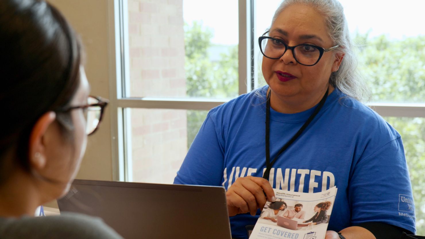 A United Way of Metropolitan Dallas navigator helps a client sign up for Affordable Care Act coverage.