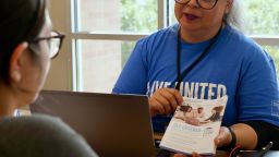 A United Way of Metropolitan Dallas navigator helps a client sign up for Affordable Care Act coverage.