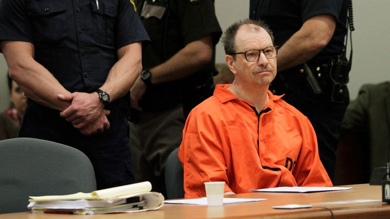 Surrounded by officers, Green River Killer Gary Ridgway sits in court during his arraignment on charges of murder in the 1982 death of Rebecca "Becky" Marrero, Friday, February 18, 2011, at the King County Regional Justice Center in Kent., Wash.