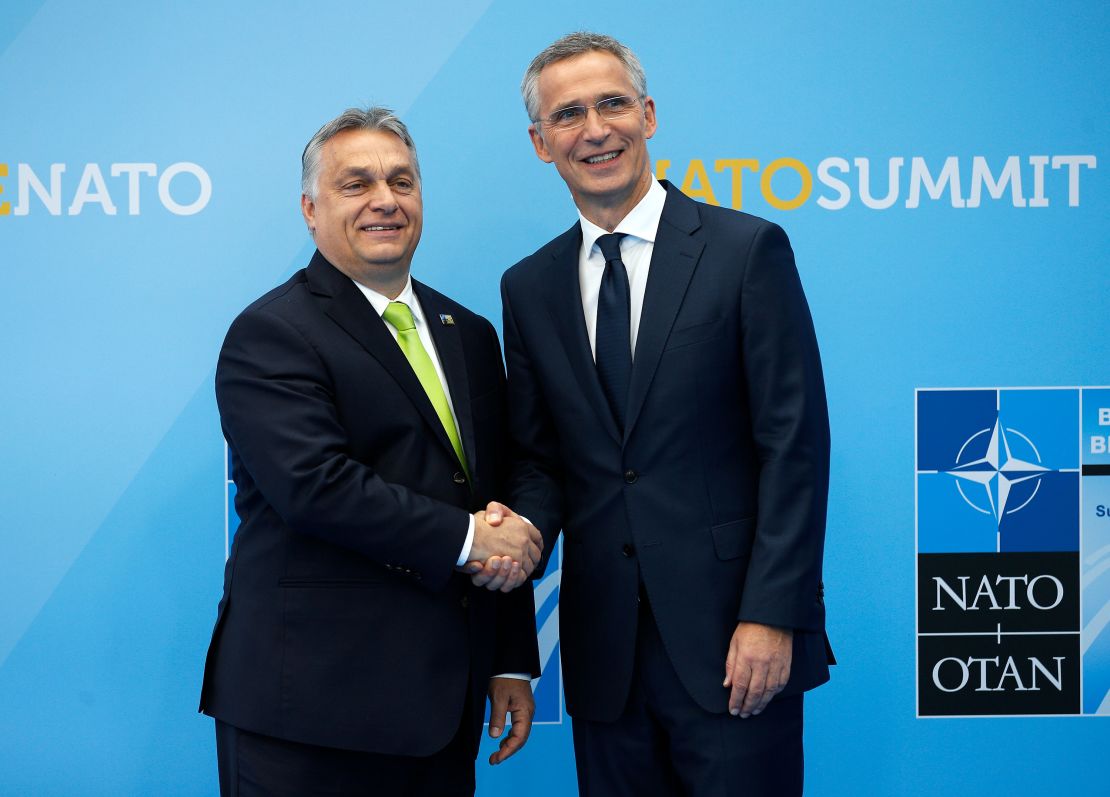 Hungarian Prime Minister Viktor Orban  (L) is welcomed by NATO Secretary General Jens Stoltenberg (R) as he arrives for the NATO (North Atlantic Treaty Organization) summit, at the NATO headquarters in Brussels, on July 11, 2018. (Photo by Francois Mori / POOL / AFP)        (Photo credit should read FRANCOIS MORI/AFP via Getty Images)