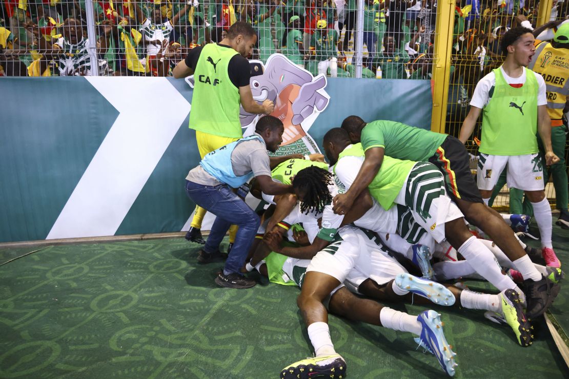 Cameroon players celebrate after Cameroon's defender #4 Christopher Wooh scored their team's third goal during the Africa Cup of Nations (CAN) 2024 group C football match between Gambia and Cameroon at Stade de la Paix in Bouake on January 23, 2024. (Photo by Kenzo TRIBOUILLARD / AFP) (Photo by KENZO TRIBOUILLARD/AFP via Getty Images)